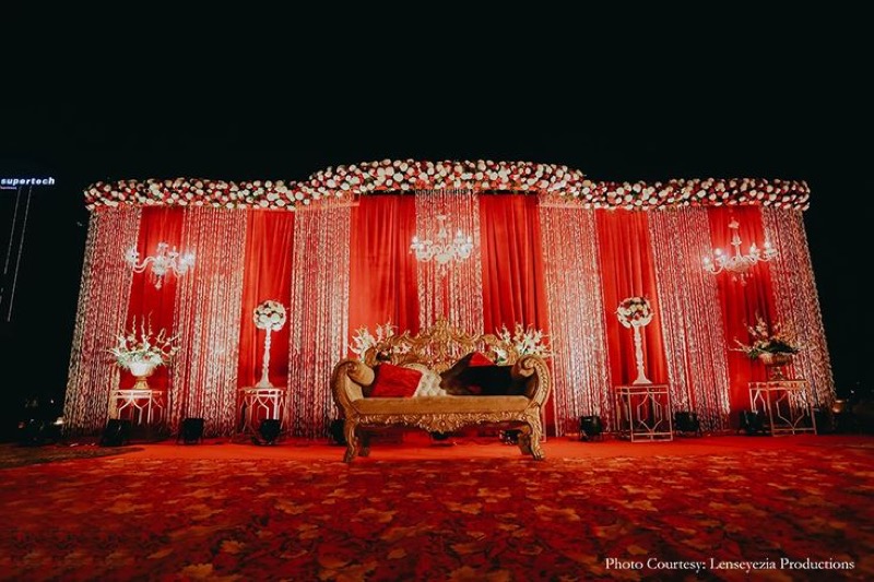Grand stage setup with floral and lighting design